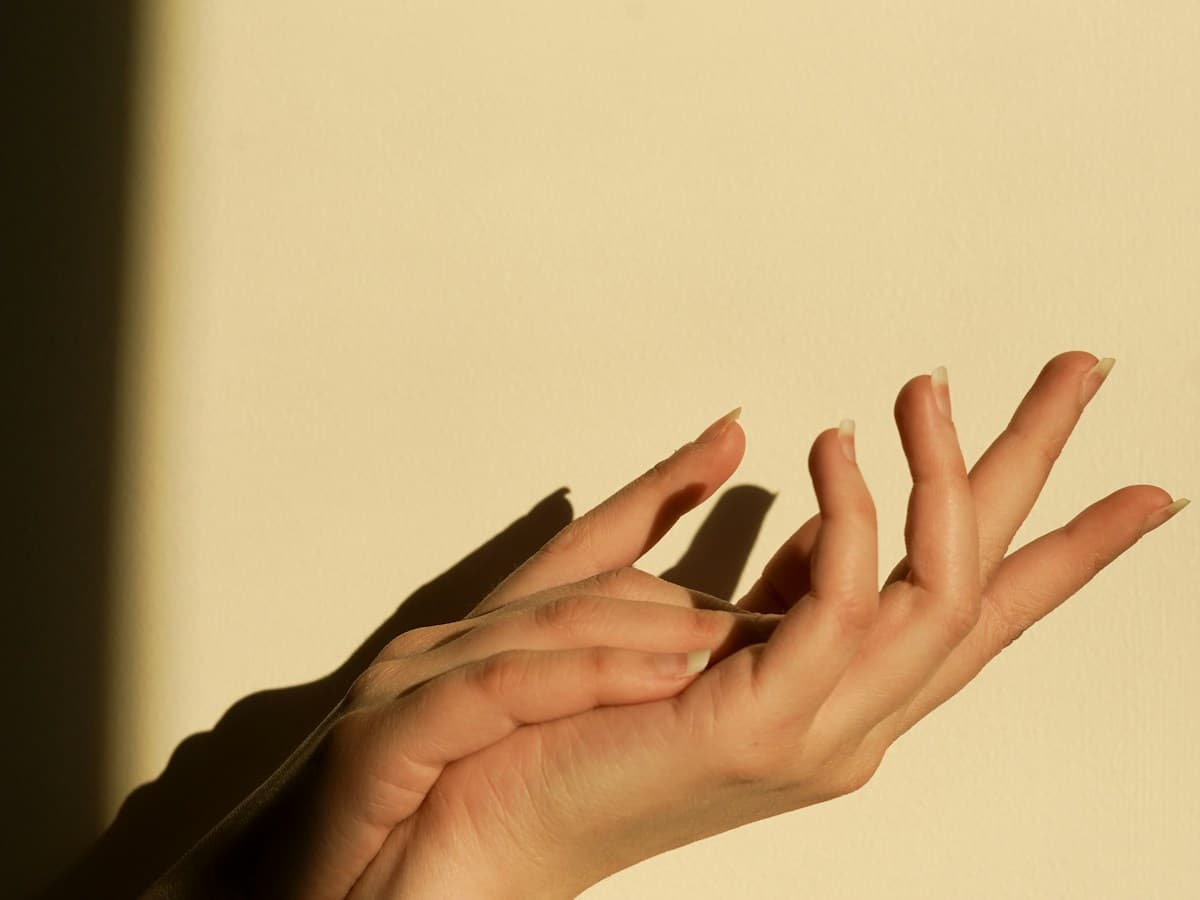 Close view of a hand and wrist resting during assessment of strain or overuse